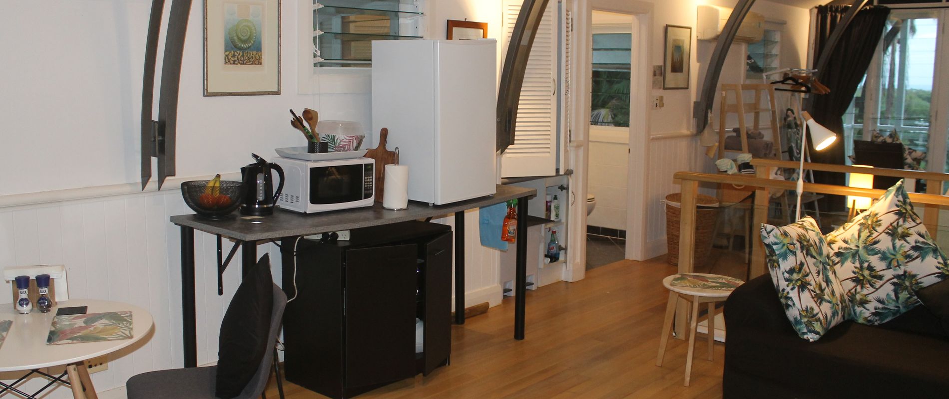 Self-contained kitchenette area Fully equipped kitchenette and dining area with microwave, bar fridge, and kettle
